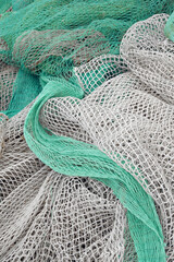 Fishing net is drying in the port. Green fishing net