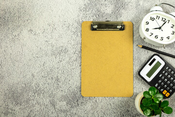 Clipboard and  calculator on white office desk background. Flat lay design.