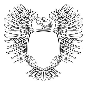 An eagle hawk or flacon shield design element in a vintage engraved woodcut style