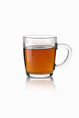 Tea in a transparent glass mug on a white background