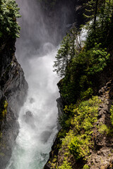 Fototapeta na wymiar Elk Falls near Campbell River on Vancouver Island, BC Canada - powerful canyon waterfall travel and tourism