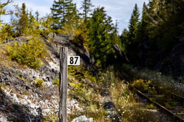 mileage post sign on abandoned logging railroad on Vancouver Island