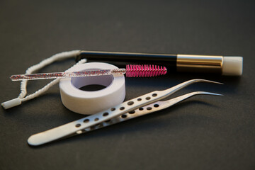 equipment for eyelash extensions on a dark background. 