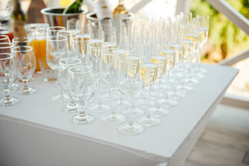 Glasses of champagne at the Banquet, white sparkling wine in wine glasses, festive mood