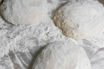 Dough pieces in flour For further baking
