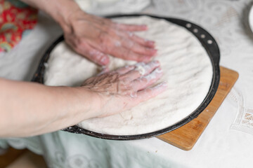 The process of making a dough cake with flour