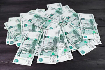 Russian rubles on wooden background