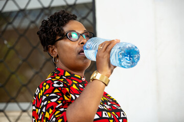 beautiful adult business woman drinking mineral water