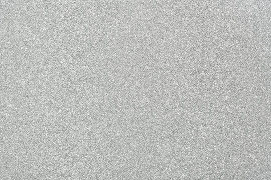 Silver paper texture or smooth gray noise background.
