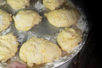 Dough pieces on a tray For further baking