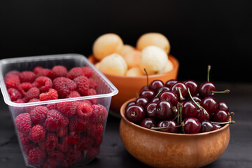 Fruits and berries on a black background