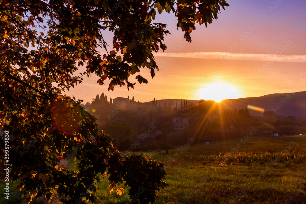 Wall mural sunset over the Chianti hills of Siena in Tuscany in autumn