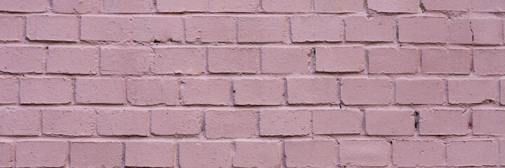 Painted brick wall. The texture of the brickwork. Wide panoramic background with masonry.