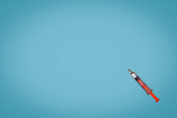 syringe on a blue background