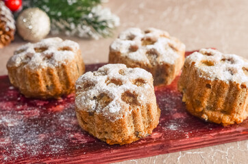 Fototapeta na wymiar Christmas baking cupcakes with snowflake pattern, christmas recipes