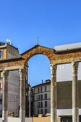 Best-known Roman ruin in Milan featuring 16 Corinthian marble columns (San Lorenzo Column, probably V century), located in front of Basilica of San Lorenzo Maggiore. Milan, Italy.