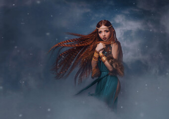redhead goddess fantasy woman walks in the clouds. Fashion model posing in studio background...