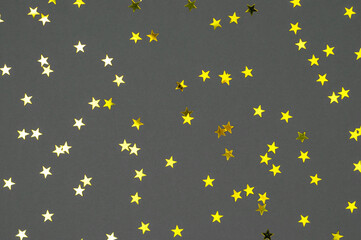 Gold stars on a gray background.