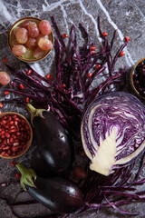 
ingredients on the table pomegranate grapes and cabbage
