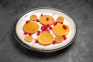 front view yummy little pancakes with red berries on dark background fruit dessert sweet