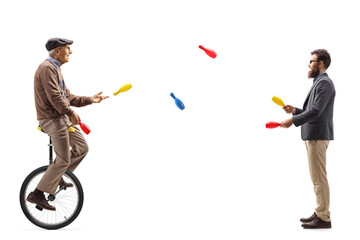 Younger and elderly manon a unicycle juggling © Ljupco Smokovski