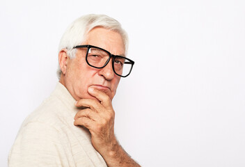 Fototapeta premium Close-up portrait of happy senior man looking at camera