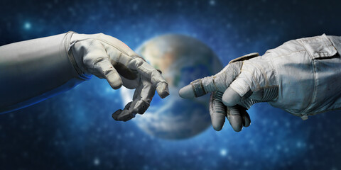 Fototapeta na wymiar Astronaut hands and on outer space background. Elements of this image furnished by NASA.