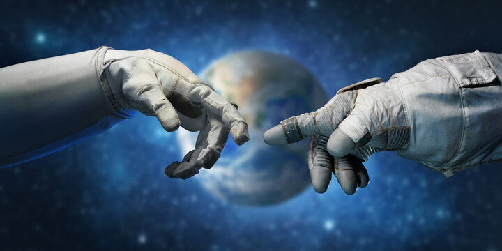 Astronaut hands and on outer space background. Elements of this image furnished by NASA.