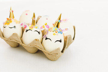 Unicorn eggs in the box isolated on white background. Happy easter.