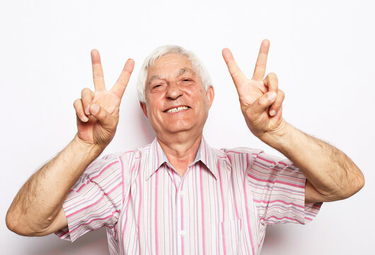 Happy Old Man Showing Victory Sign, Positive Or Peace Gesture.