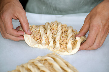 Baker formatting special stuffed bread