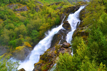 Beautiful waterfall in the Jostedalsbreen National Park in Norway. Pathway to Briksdal or...