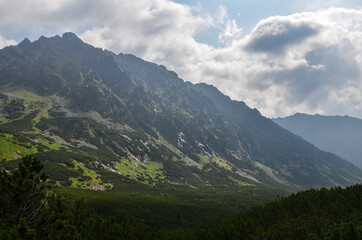 Obraz na płótnie Canvas Beautiful summer landscape with rocky mountain peaks at High Tatras mountains, Slovakia. Hiking adventure.