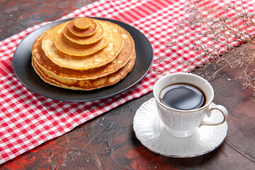 Top view of homemade pancake and a cup of tea for breakfast