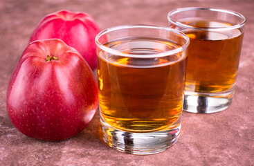 Two glasses of red apple. Concentration of organic products.