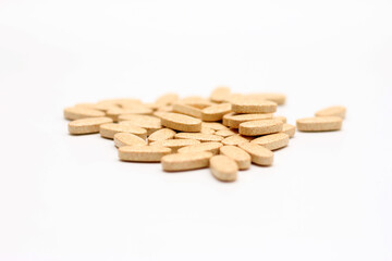 Lots of pills on white background
