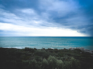 Stormy cloudy weather at the sea, azure water, seascape background