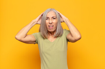 middle age woman feeling frustrated and annoyed, sick and tired of failure, fed-up with dull,...
