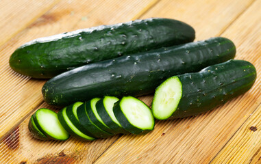 Ripe cucumbers on a wooden table. High quality photo