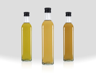 Varieties of bottled olive oil isolated from the background, liquid gold