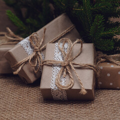 Fototapeta na wymiar DIY brown diy gift boxes under christmas tree