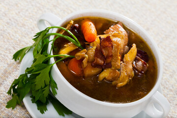 Image of tasty scottish traditional soup cock-a-leekie with chicken, bacon and leek