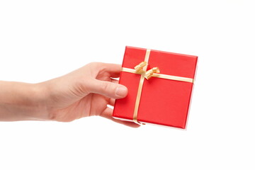 Hand handing over a gift on white background, copy space