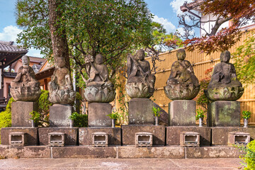 Six Jizo bodhisattva sitting statues symbol of filial piety to protect children in afterlife and...