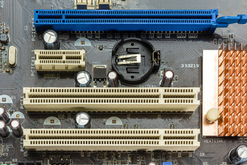 Different types of pci express slot and copper heat sink or radiator on computer motherboard.