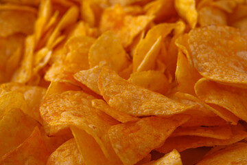 Potato chips or crisps . Close-up of potato chips or crisps. Food background.