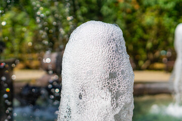 Sunny view of water sparkles of fountains in Nalchik, Kabardino-Balkaria, Russia
