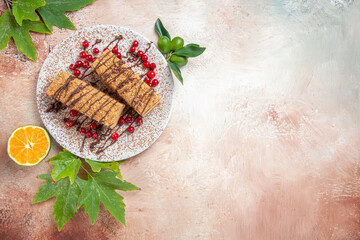 top view cake slices with red berries on light background biscuit sweet cake