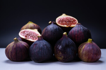 Tasty figs on a black background. Top view.