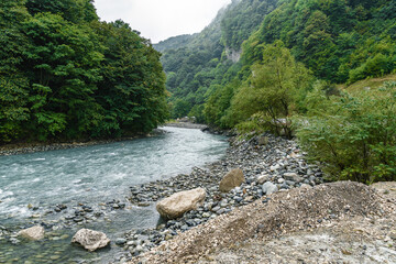 Cloudy view of Monument Wasgergi (George The Victorious) in a rock of North Ossetia Alania, North Caucasus,  Russia.